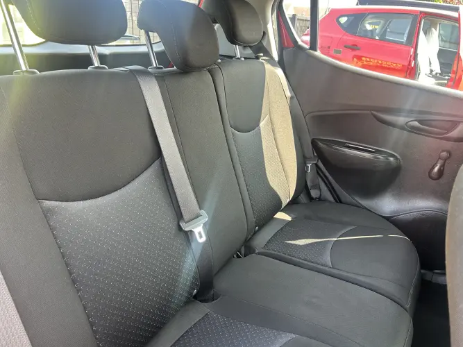 Angled front view with bag zipped and handles upright.