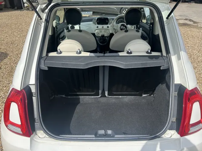 Angled front view with bag zipped and handles upright.