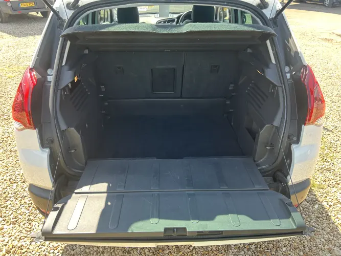 Angled front view with bag zipped and handles upright.