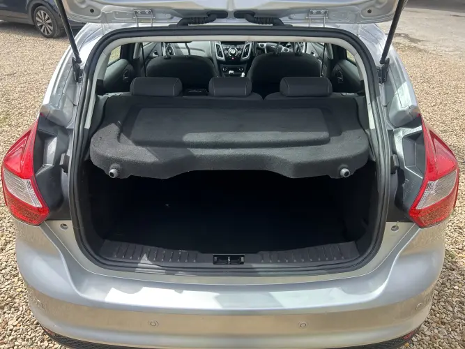 Angled front view with bag zipped and handles upright.