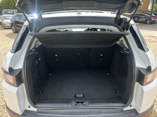 Angled front view with bag zipped and handles upright.
